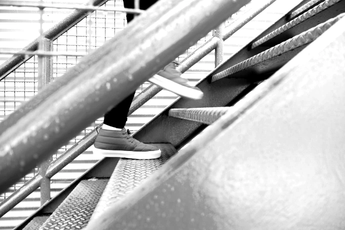 person stepping on blue stairs